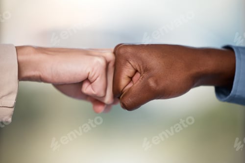 Preview: Shot of two unrecognisable businesspeople bumping fists