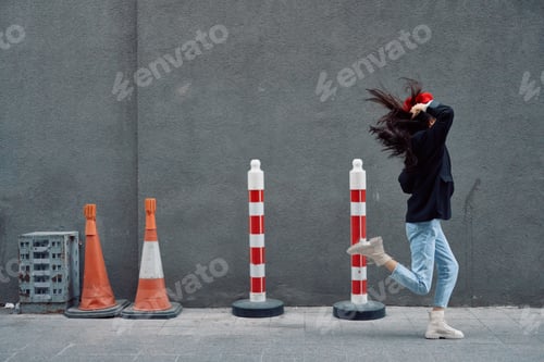 Preview: Fashion woman running down the street in front of the city tourist in stylish clothes with red lips
