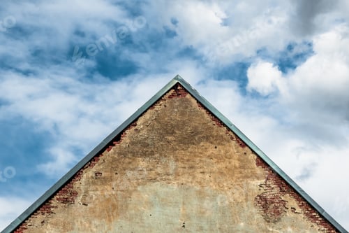 Preview: Old Austrian brick roof house building in European architecture style against the sky.