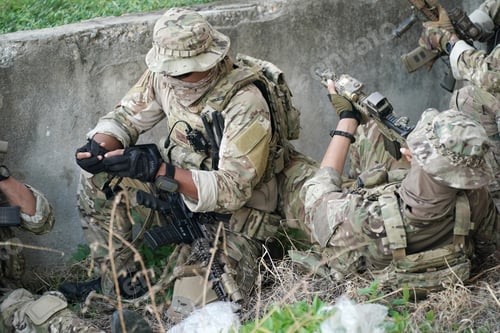 Preview: Soldier in full US MARSOC armed with assault rifle run through the abandoned building. Military