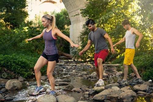 Preview: Joggers crossing stream under arch bridge, Arroyo Seco Park, Pasadena, California, USA