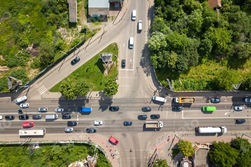 Preview: Top down aerial view of busy street intersection with moving cars traffic