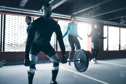Preview: Black man exercising lifting weight