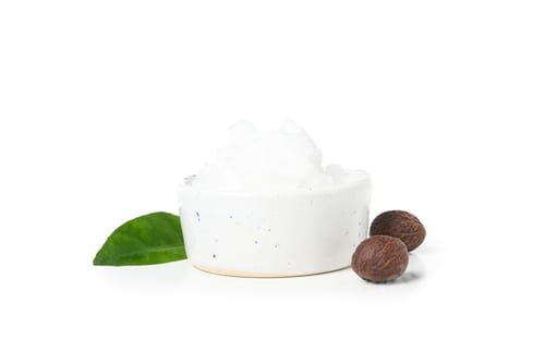 Preview: Bowl with Shea butter and ingredients isolated on white background