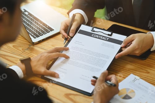 Preview: Male investor signing contract law conditions with his business partner at meeting