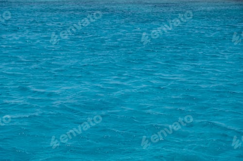 Preview: Sea water background. Ocean surface blue color, small ripples. Summer vacation empty backdrop