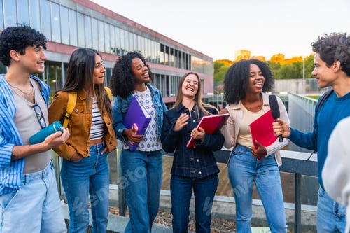 Preview: Diverse students laughing during outdoor university campus interview