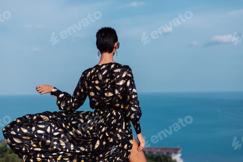 Preview: woman in black golden cape