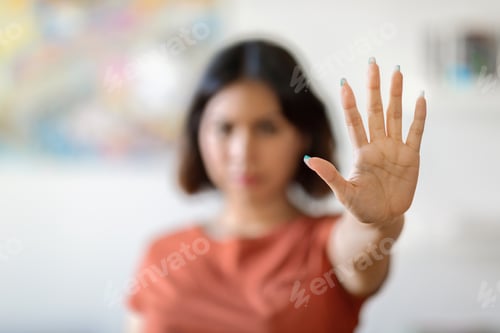 Preview: Young Arab Woman Showing Stop Gesture With Open Palm