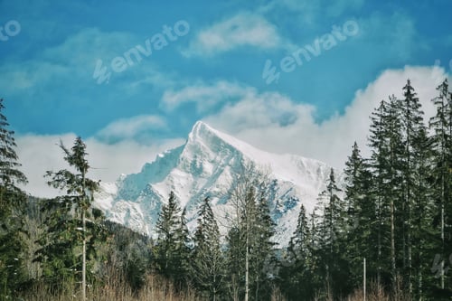 Preview: Snowy mountains, blue sky, blue background, beautiful winterland, rocky mountains, sunny day