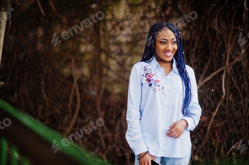 Preview: Stylish african american girl with dreads
