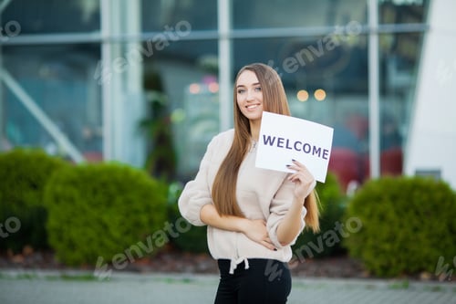 Preview: Women business with the poster with welcome message
