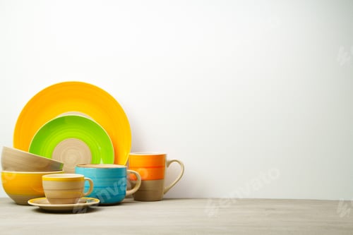 Preview: Set of colored ceramic dishware front view
