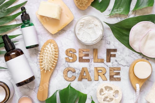 Preview: Self Care text near cosmetics, skincare accessories and monstera leaves, mockup