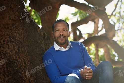 Preview: Portrait of Young smiling african-american man wearing informal clothes outside.