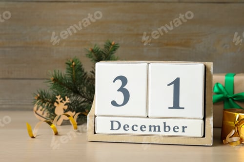 Preview: Wooden block calendar and Christmas decor on table. Holiday countdown
