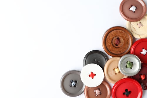 Preview: Many colorful sewing buttons on white background, top view