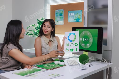 Preview: Business women discussing esg sustainability strategy in office