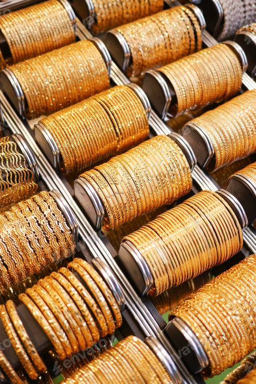 Preview: golden color bangles display for sale at local store ,