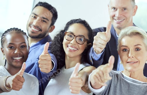 Preview: Weve got whatever you need. Shot of a group of businesspeople showing a thumbs up at work.
