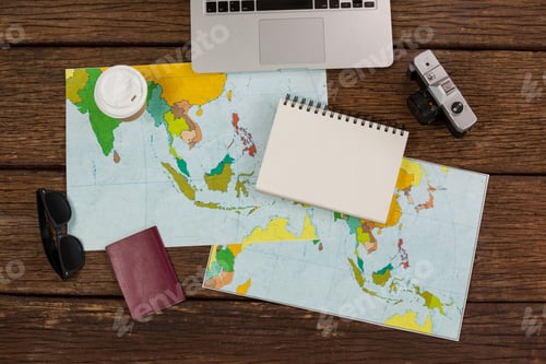 Preview: Laptop, camera, notepad, maps, passport and wayfarer