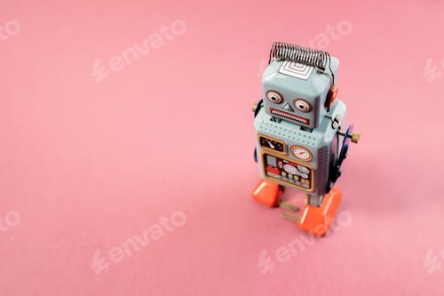 Preview: Vintage robot tin toy on pink background