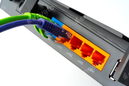 Preview: Modern router with cables plugged in close up