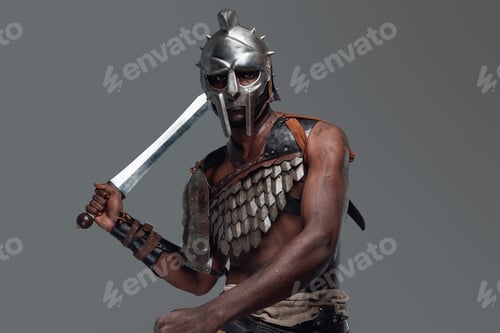 Preview: Isolated in grey background african gladiator with sword
