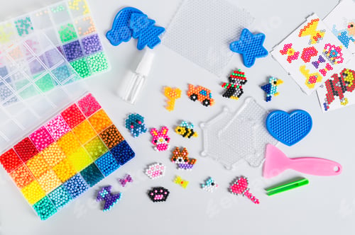 Preview: Children's toys made of aqua beads and a set for making on the table top view