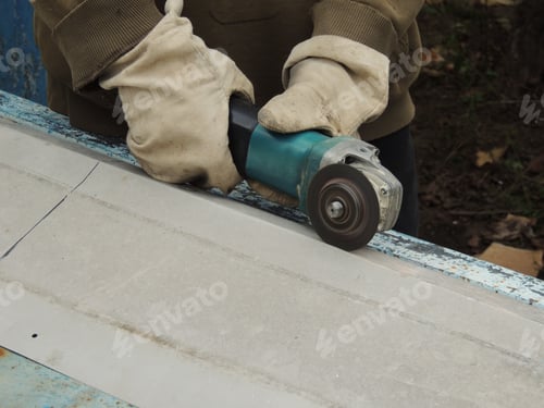 Preview: The builder is working with a grinder