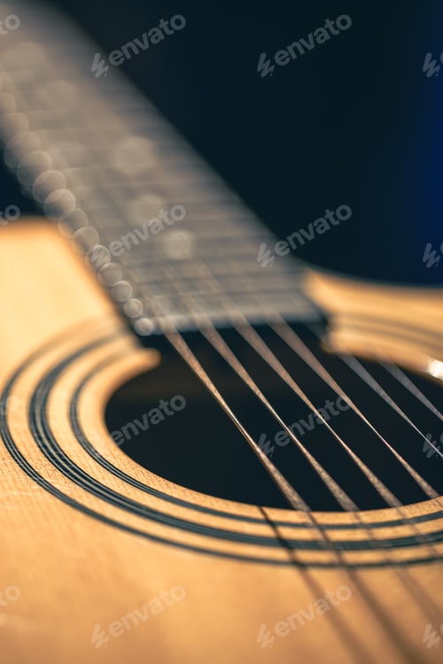 Preview: Close up of guitar and strings with shallow depth of field, soft focus.