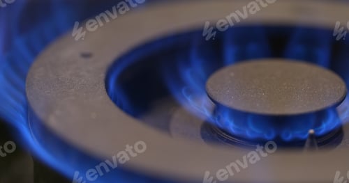 Preview: Stove burner igniting into a blue cooking flame
