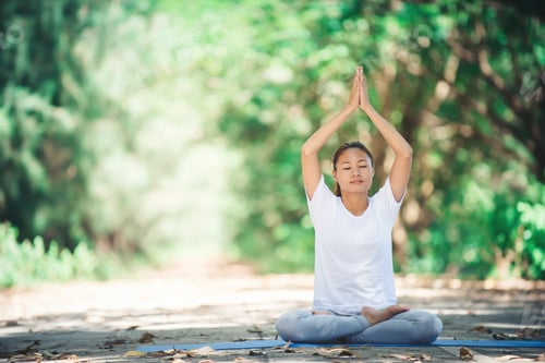 Preview: Young asian woman doing yoga in the morning at the park. Healthy lifestyle concept.