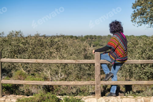 Preview: Mature woman enjoying freedom and nature views
