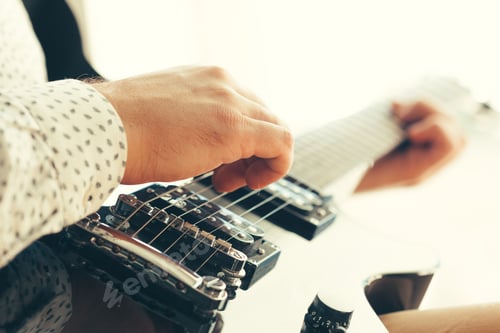 Preview: man playing electric guitar