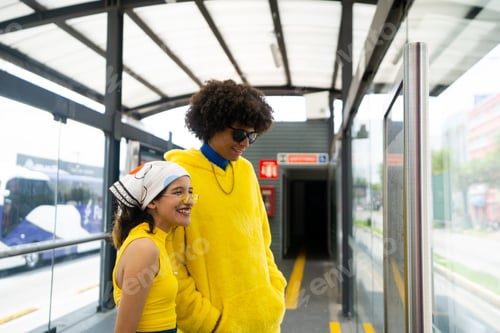 Preview: young woman and afro mexican man are looking the station map