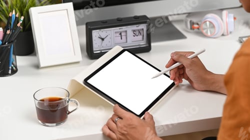 Preview: Cropped shot of businessman using stylus pen writing on digital tablet.