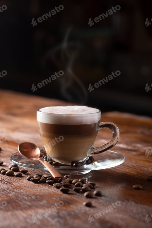 Preview: Cup of Coffe With Milk on a Dark Background. Hot Latte or Cappuccino Prepared With Milk