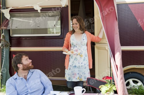 Preview: Couple picnicking outside trailer