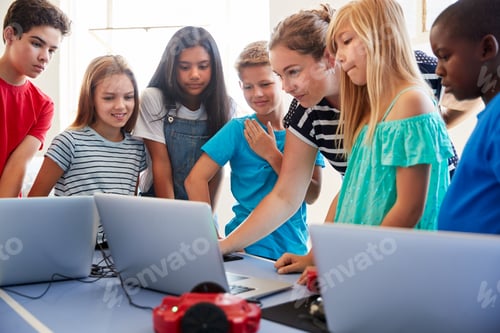 Preview: Group Of Students In After School Computer Coding Class Learning To Program Robot Vehicle