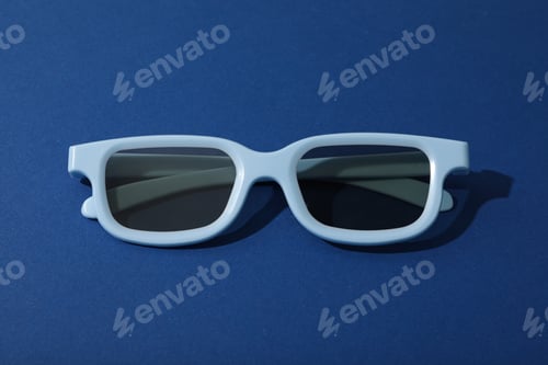 Preview: Light blue glasses with tinted lenses on dark blue background