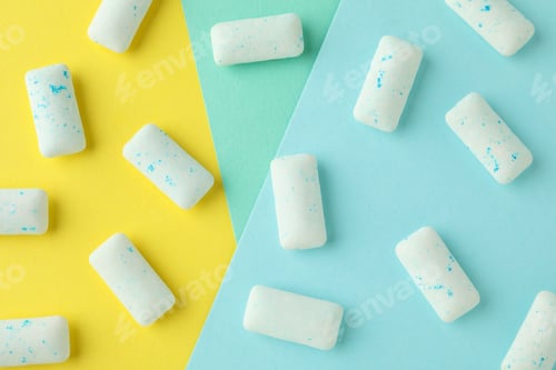 Preview: Chewing or bubble gum on multicolored background