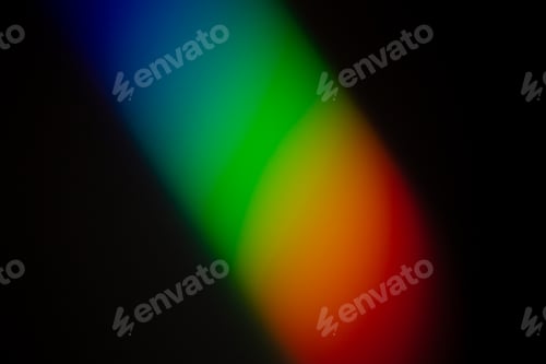 Preview: Clear and vibrant Rainbow color gradient reflect on a dark wall photograph.