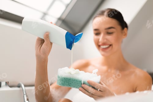 Preview: Cheerful Lady Bathing Squeezing Shower Gel Holding Sponge In Bathroom