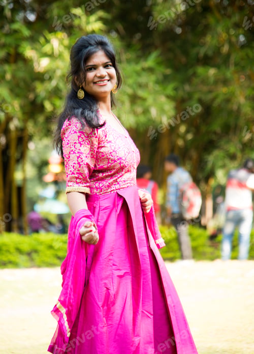 Preview: Outdoor portrait of beautiful young Indian girl in traditional dress.
