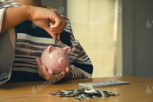 Preview: Person Saving Money in Pink Piggy Bank