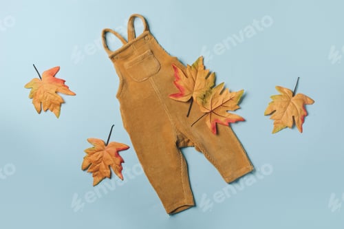 Preview: Mustard baby romper, yellow autumn leaves on blue background. Set of baby clothes