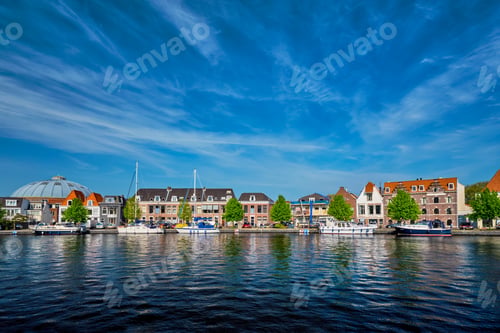 Preview: Boats and houses on Spaarne river. Haarlem, Netherlands