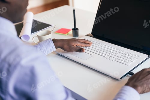 Preview: Young African Businessman Working.