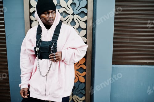 Preview: Stylish urban style african american man in pink hoodie